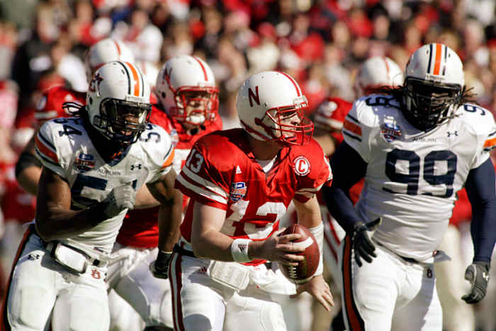 Nebraska quarterback Zac Taylor evades the Auburn pass rush.